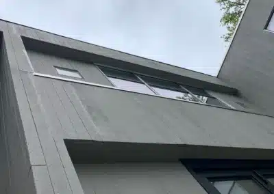 Gray panel siding eave detail