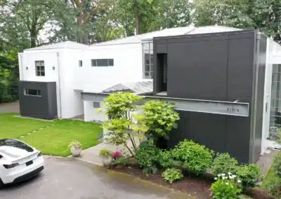 Modern home with a charcoal metal panel wing