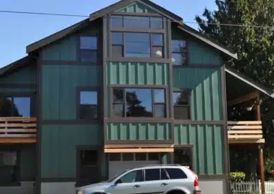 Green board and batten siding on a three-story home