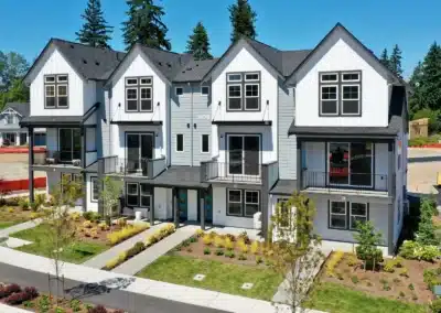 Aerial view of white board and batten townhomes