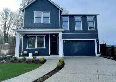 Navy board and batten siding on a two-story home