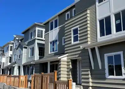 Gray lap siding on a row of townhomes