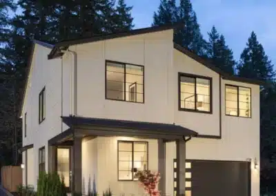 Cream panel siding on a modern home at dusk