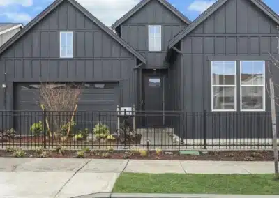 Charcoal board and batten siding on a two-gable home