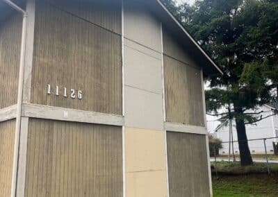 Original cladding on a gable elevation at Phoenix Court Apartments before renovation.