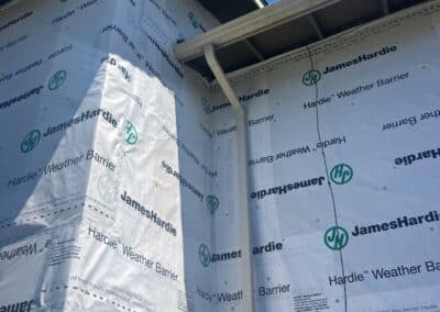 Taped weather barrier seams at a building corner, Phoenix Court Apartments.