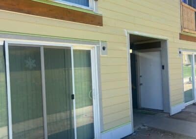 Original siding and trim at patio doors, Phoenix Court Apartments, Kent WA.