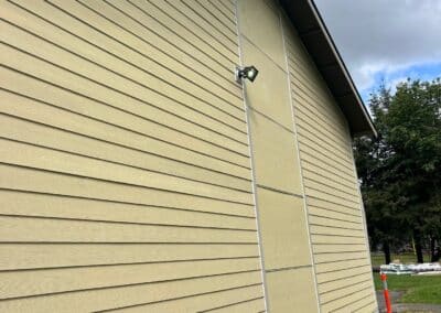 The original lap siding at Phoenix Court Apartments before it was removed.