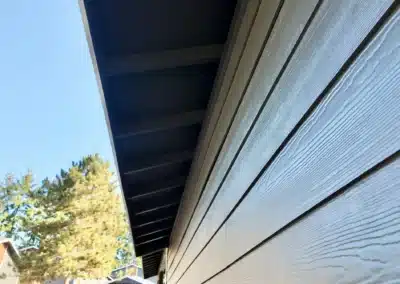 Lap siding running to a finished soffit and fascia on an apartment building