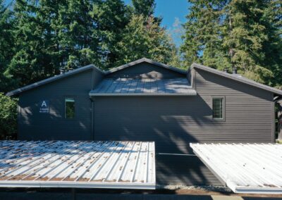 Aerial view over the rooflines and completed exterior at Redmond Park.