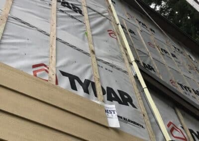 A wall part-stripped of its original cladding at Redmond Park.