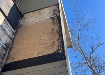 Weathered cladding at the eave at Westboro Condos before the renovation.
